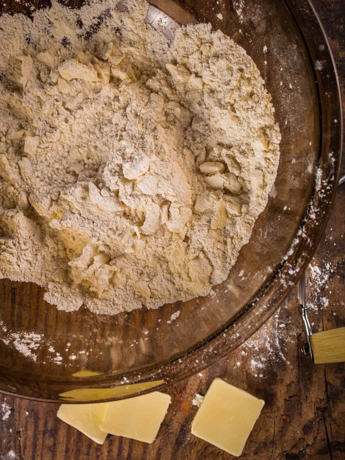 butter crumbled into flour