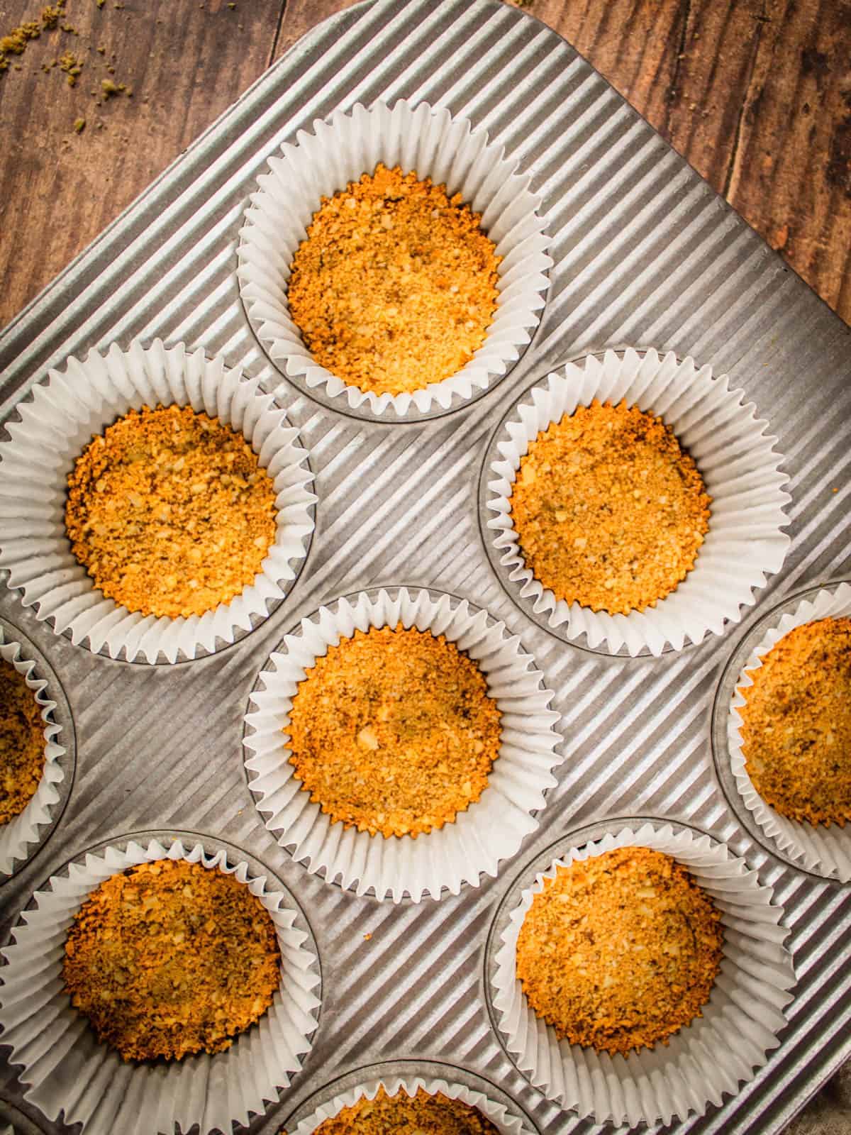 baked graham cracker crumbs in muffin cups