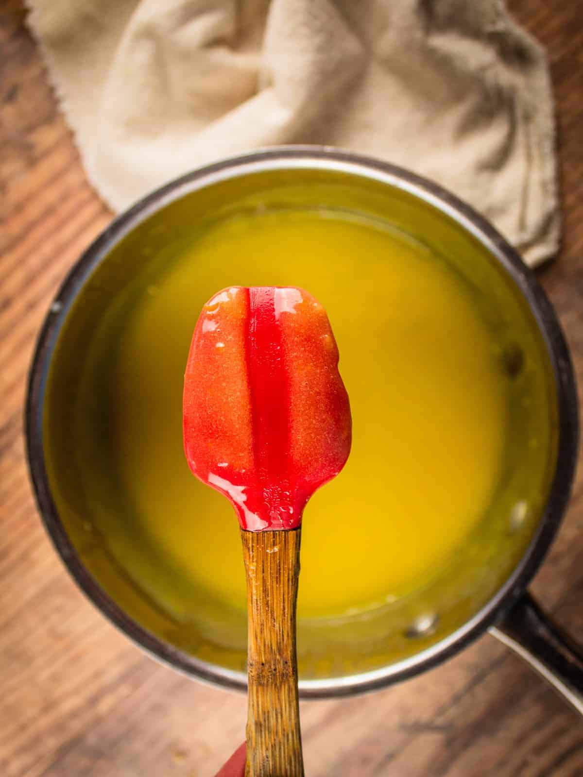 red spatula with lemon curd on it