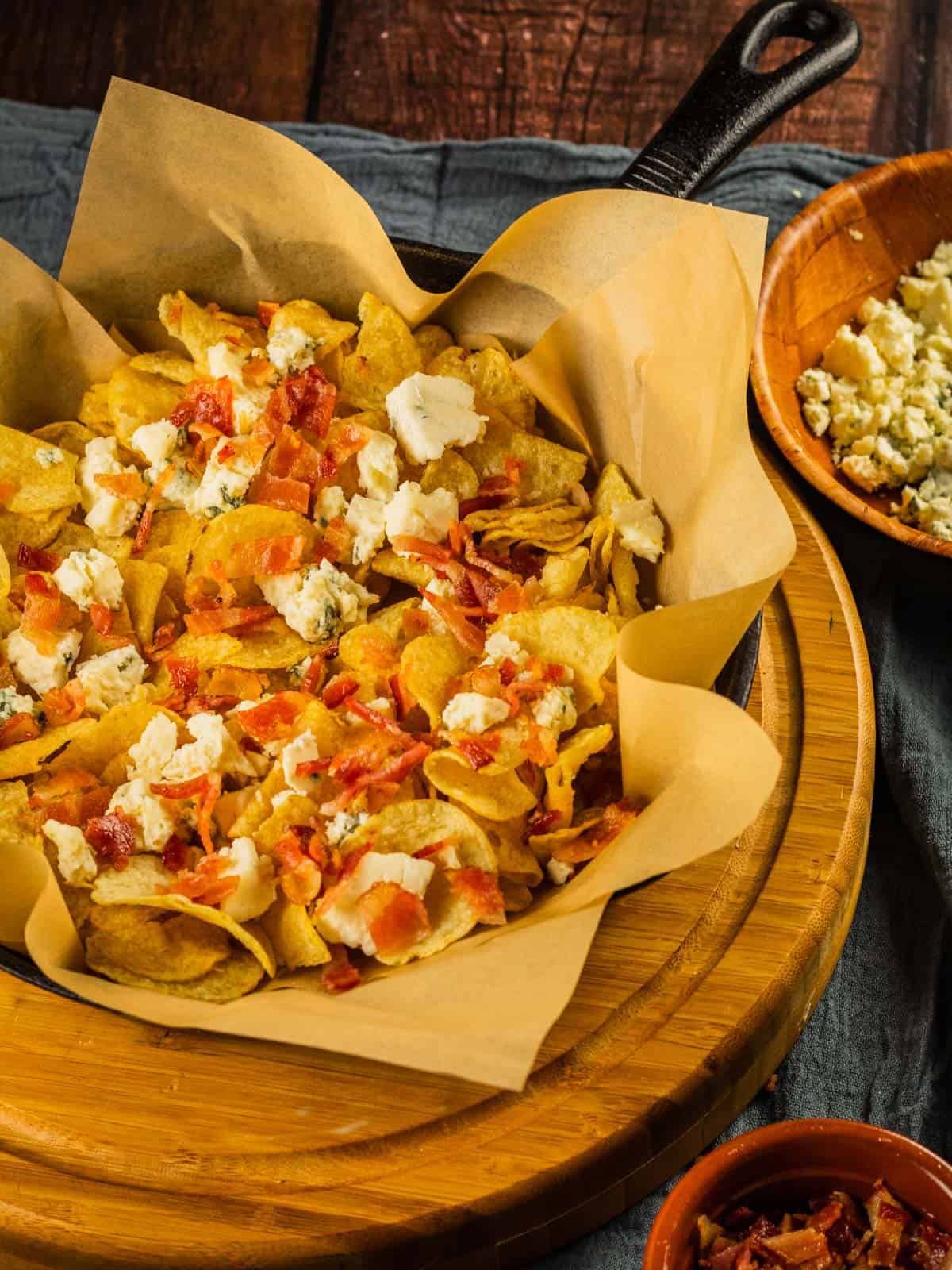 kettle chips sprinkled with bacon pieces and blue cheese crumbles