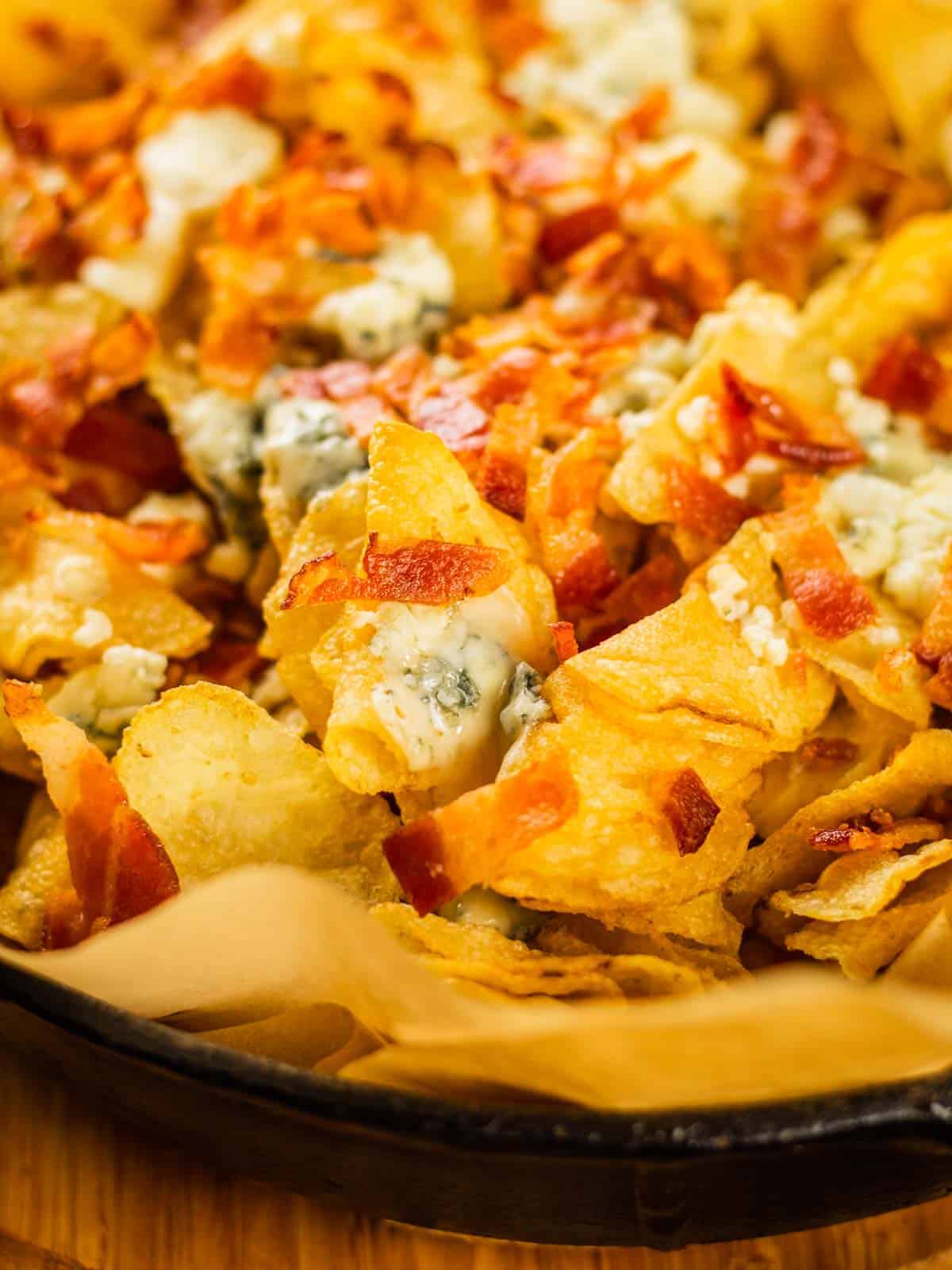baked kettle chips topped with melted blue cheese and crispy bacon