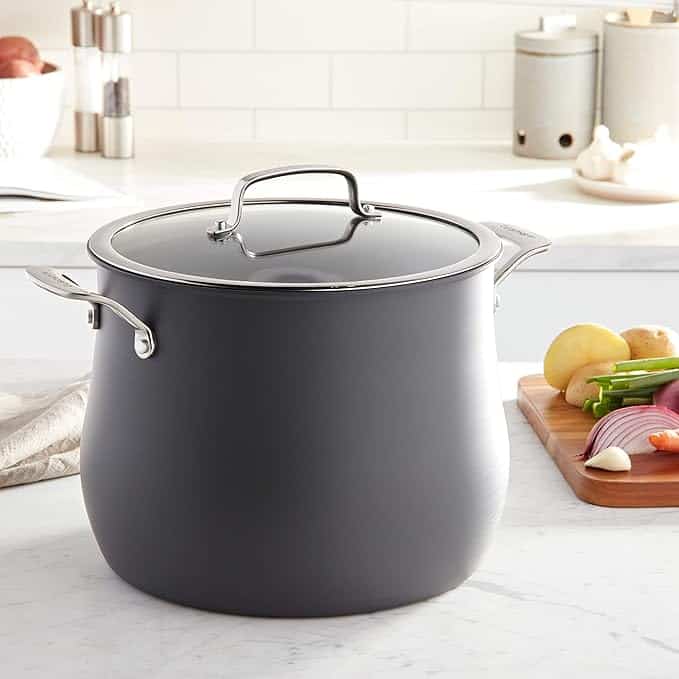 large black stock pot with a lid on it.