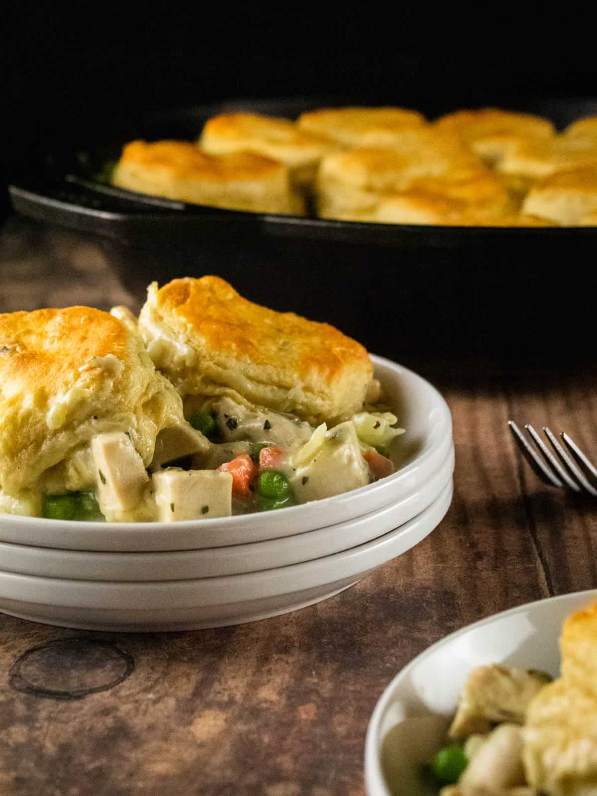 serving of chicken pot pie topped with biscuits