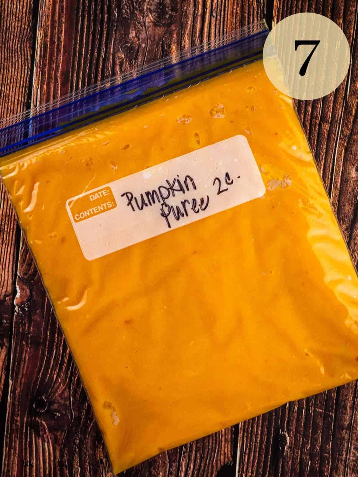 pumpkin puree in a ziptop bag on a table that is labeled "pumpkin puree two cups"