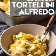 bowl and baking dish filled with baked tortellini alfredo.