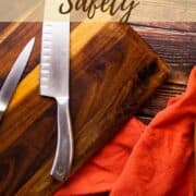 chefs knife and paring knife on a cutting board.