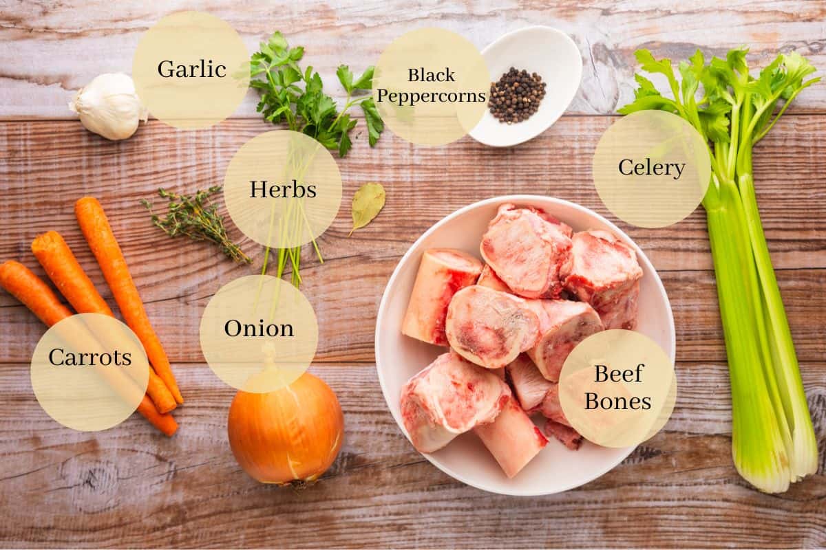 beef bones, garlic, carrots, onions, fresh herbs, peppercorns, bay leaf and celery.