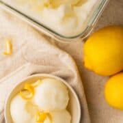 lemon sorbet in glass container and small bowl.