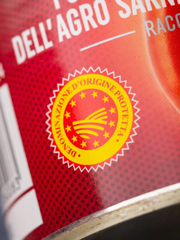 DOP red and yellow label on a can of DOP certified san marzano tomatoes.