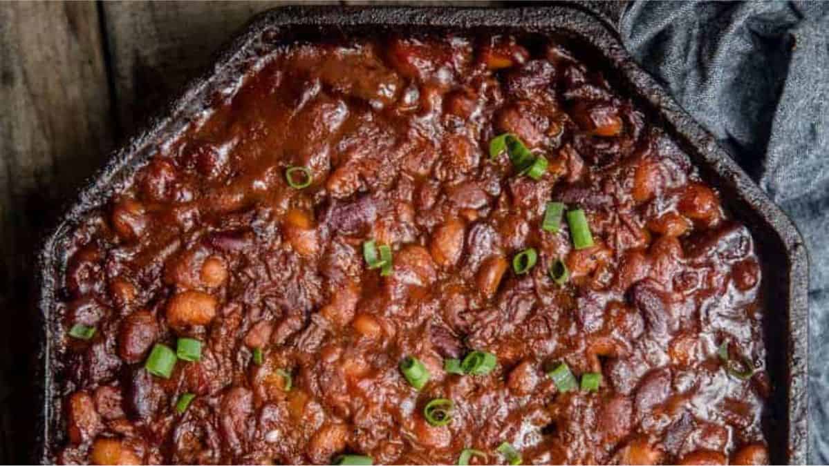 bbq baked beans in a cast iron skillet.