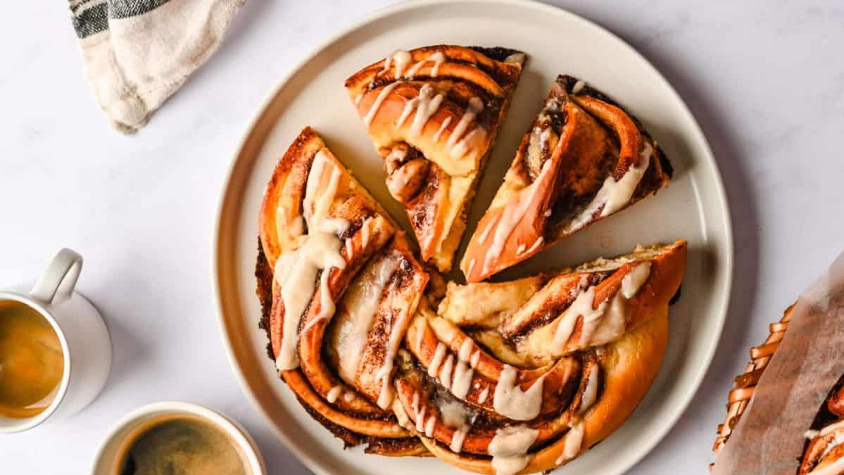 slices of braided cinnamon bread drizzled with icing.