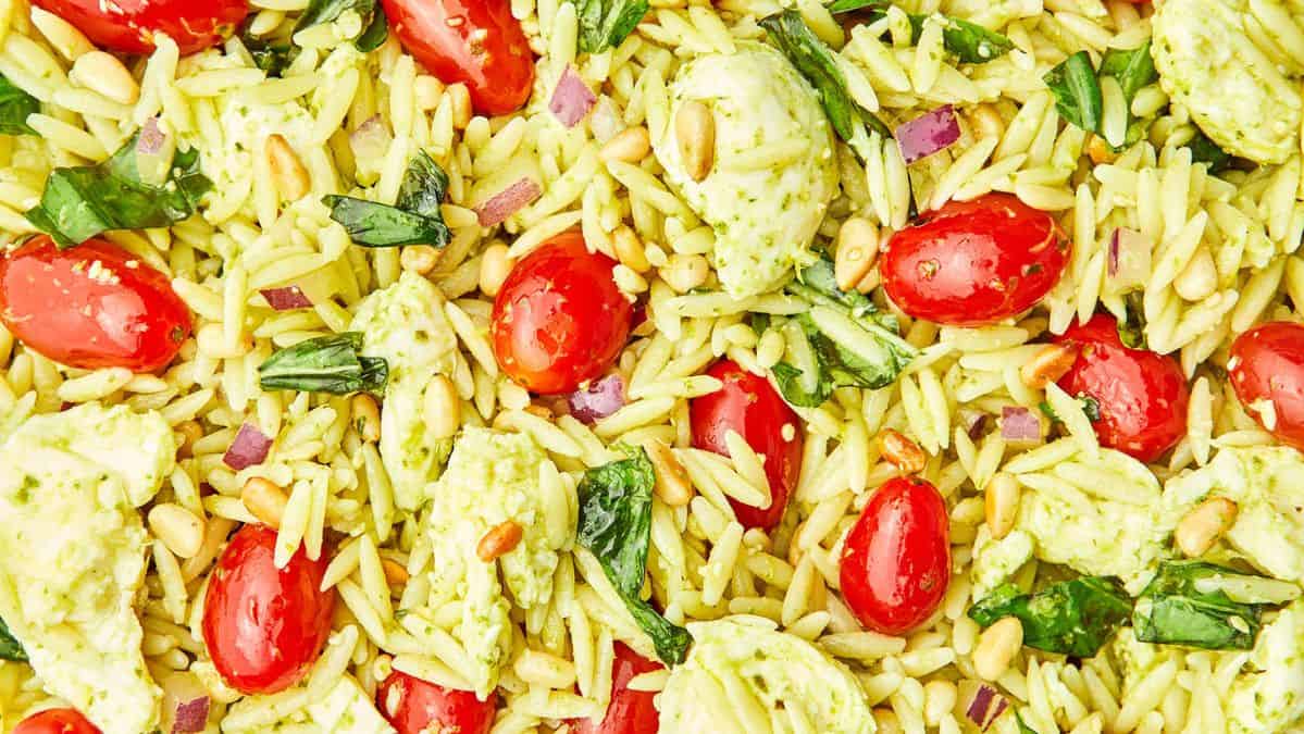 orzo salad with tomatoes and pesto dressing.