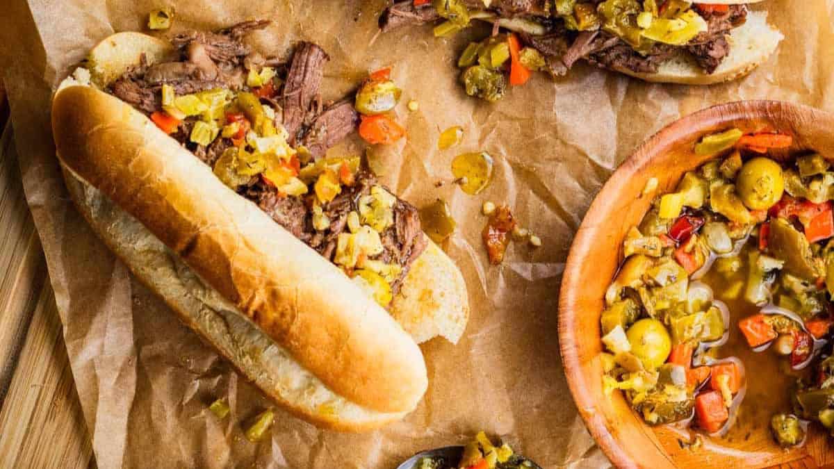 itailan beef sandwiches topped with giardiniera.