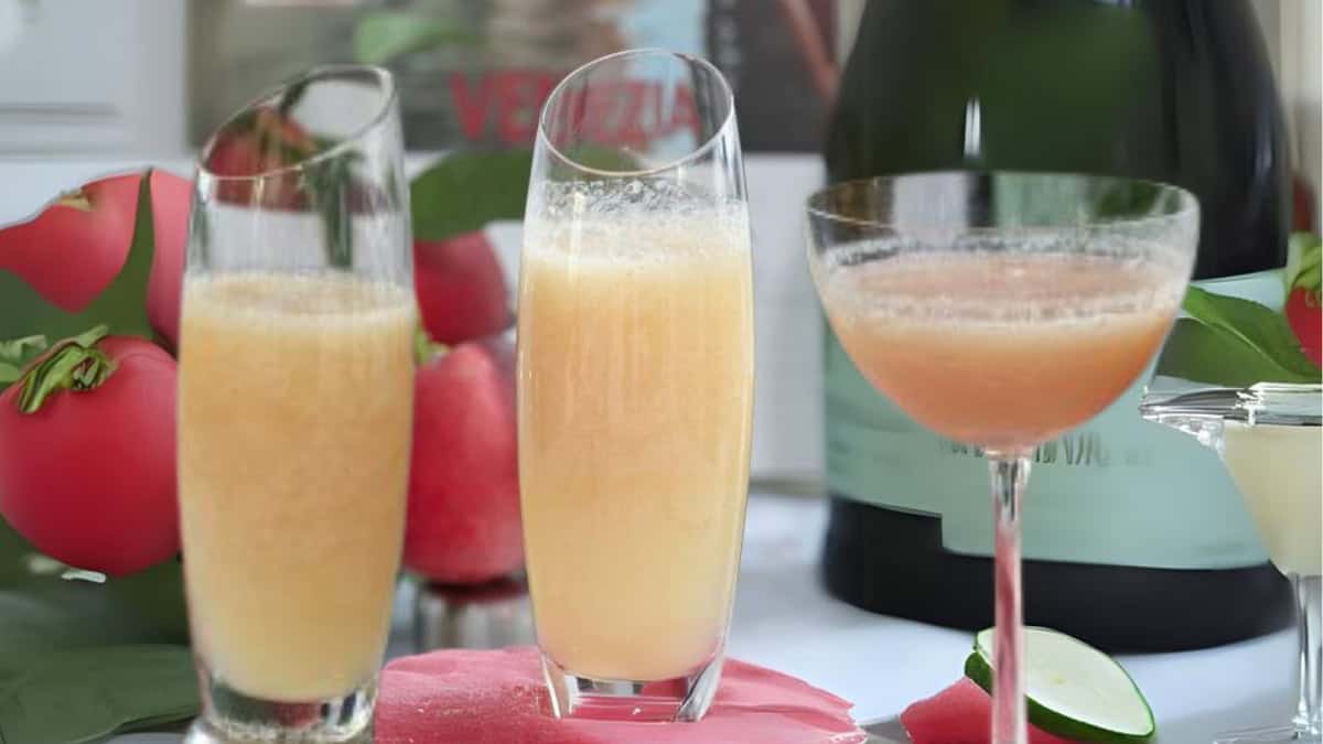 peach bellini in a stemless champagne flute.