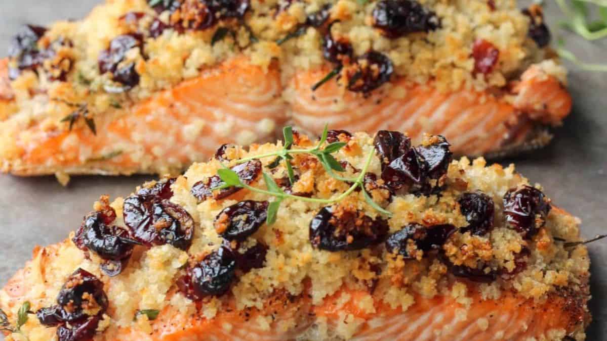 Baked salmon topped with breading with cranberries.