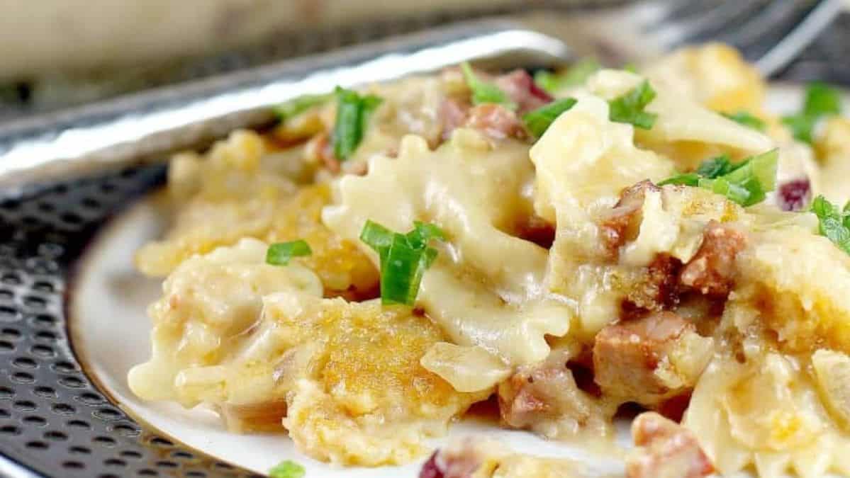 Macaroni and cheese with cranberries and chorizo topped with fresh herbs.